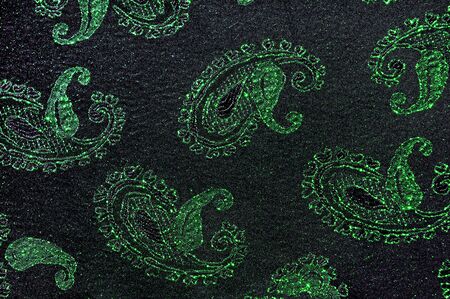 Green and black floral fabric backgroundの写真素材