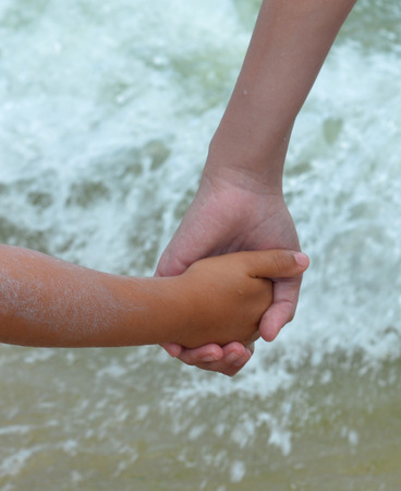 Mother and child holding handsの写真素材