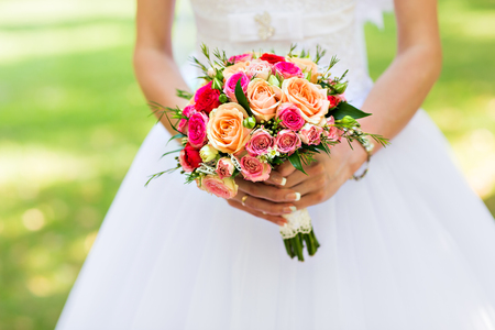 Bride Holding Wedding Bouquet with beautiful Flowersの写真素材