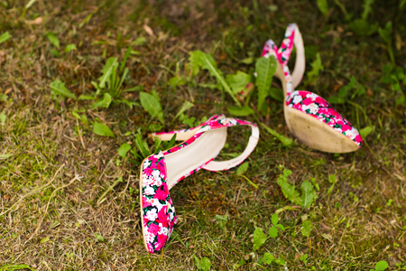 beautiful pink shoes on the green grassの写真素材