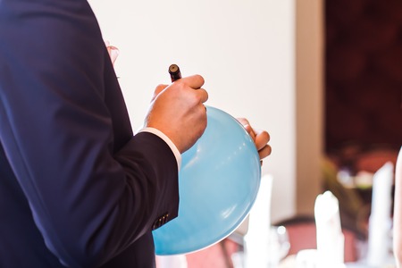 the man wrote in a blue balloonの写真素材