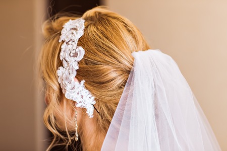 Hair stylist makes the bride before the weddingの写真素材