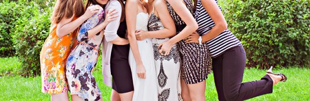 bridesmaids with bride,  girlfriends in colorful dressesの写真素材
