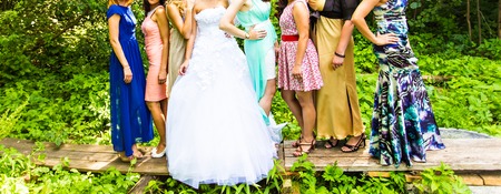 bridesmaids with bride,  girlfriends in colorful dressesの写真素材