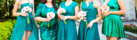 bridesmaids with bride,  girlfriends in colorful dressesの写真素材