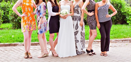 bridesmaids with bride,  girlfriends in colorful dressesの写真素材
