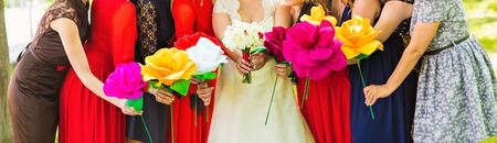 bridesmaids with bride,  girlfriends in colorful dressesの写真素材