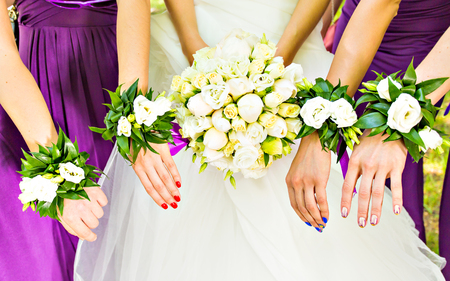 bridesmaids with bride,  girlfriends in colorful dressesの写真素材