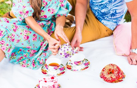 Happy Couple Having Romantic Picnic Together Outsideの写真素材