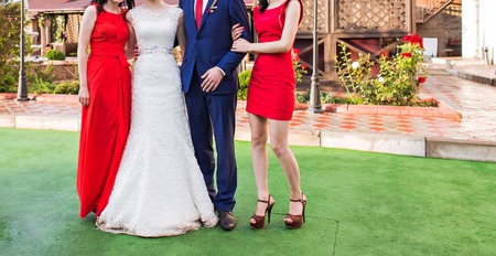 Bridesmaids and wedding couple  in the open airの写真素材