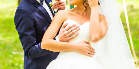 Sexy beautiful bride and her funny groomの写真素材