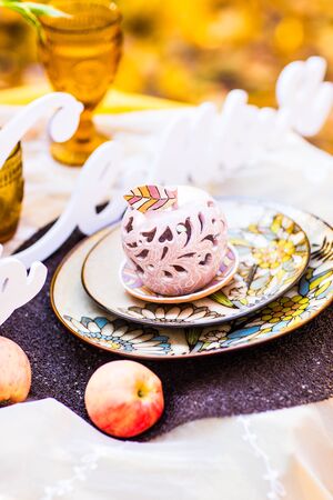 Decorated table for a romantic dinner in autumn Park.の写真素材