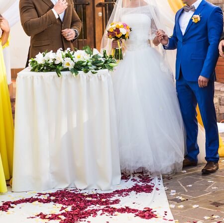 Couple Getting Married at an Outdoor Wedding Ceremony
