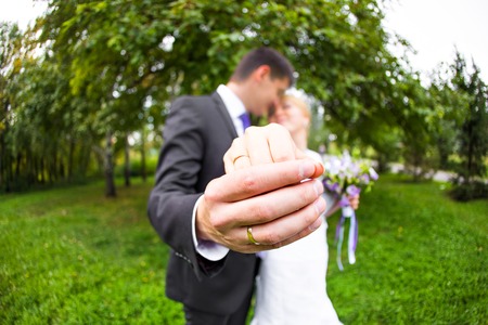 Hands of the groom and the bride with wedding ringsの写真素材