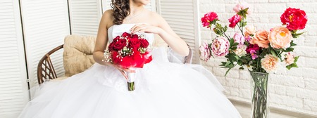 Beautiful wedding bouquet in hands of the brideの写真素材