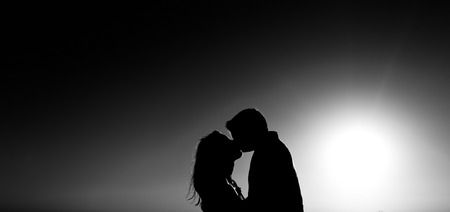 Romantic couple in love. silhouette of a loving coupleの写真素材