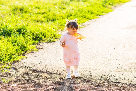 little girl with bottle of mineral waterの写真素材