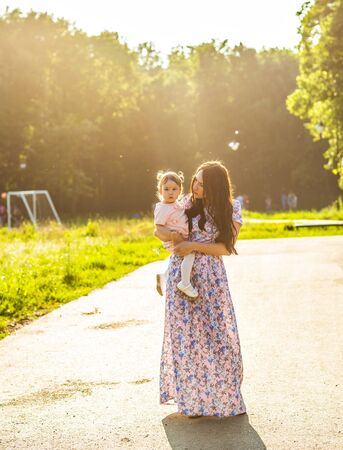 Happy Mother and daughter in the parkの写真素材