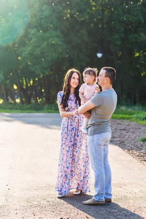Happy Young Mixed Race Ethnic Family Walking In The Park.の写真素材