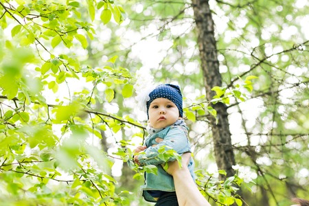 cute baby-girl outdoors.  a child walks in the parkの写真素材