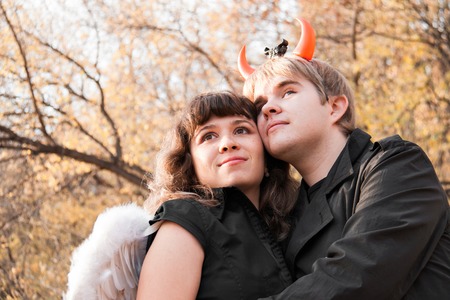 Portrait of angel and devil. Halloween day