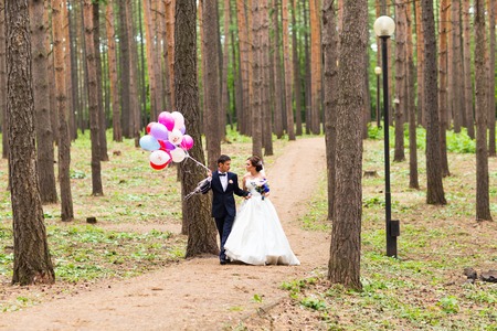 Couple of bride and groom with balloons. Wedding dayの写真素材