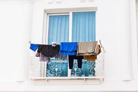 Clothes hanging on the balconyの写真素材