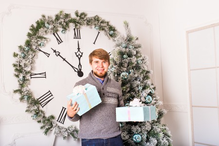 happy young  man carries gifts. Christmas  timeの写真素材
