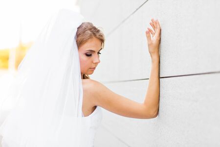 Portrait of a young bride in a white dress.