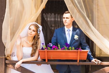bride and stylish groom  on the restaurant terrace.の写真素材