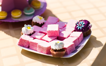 Sweet holiday buffet with cupcakes  and other desserts.の写真素材