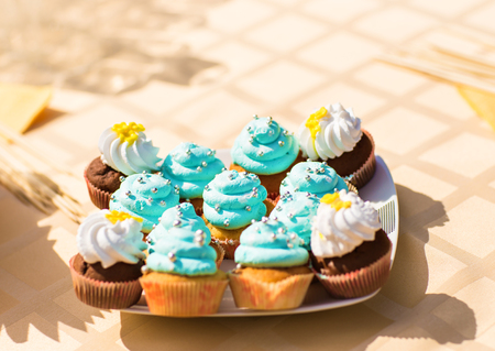 Sweet holiday buffet with cupcakes  and other desserts.の写真素材