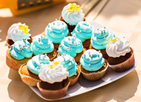 Sweet holiday buffet with cupcakes  and other desserts.の写真素材