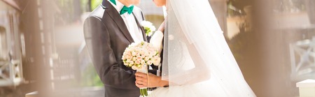 Bride and groom having a romantic moment on their wedding day.の写真素材