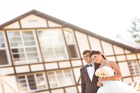 Bride and groom having a romantic moment on their wedding day.の写真素材