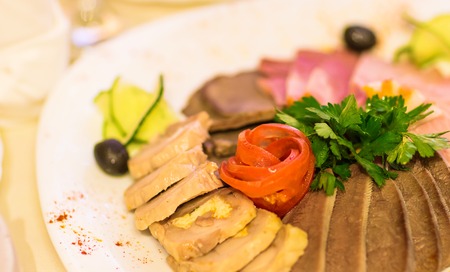 Assorted meat products including ham and sausages.の写真素材