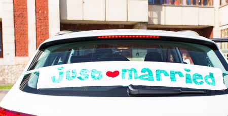 Wedding car with just married sign in a blackboardの写真素材