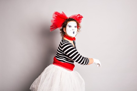 Portrait of a comedian  woman dressed up as a mime, April Fools Day concept.の写真素材