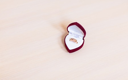 gold wedding rings on the table. Wedding accessoriesの写真素材