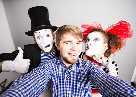 Man and Funny couple of mimes taking a selfie photo.の写真素材