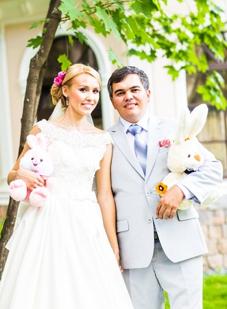 wedding couple with wedding  toys, bunnies and rabbits.の写真素材