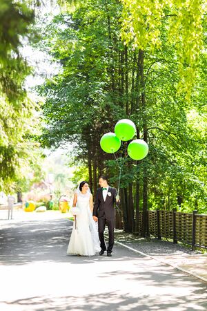Stylish beautiful happy bride and groom, wedding celebrations outdoor.の写真素材