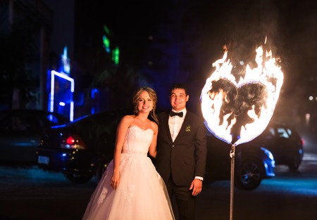 set fire to the couple on their wedding heart.の写真素材