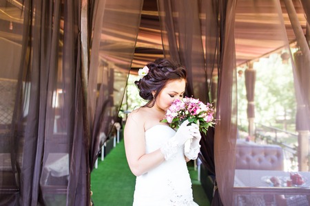 coloured nice wedding bouquet in bride's handの写真素材