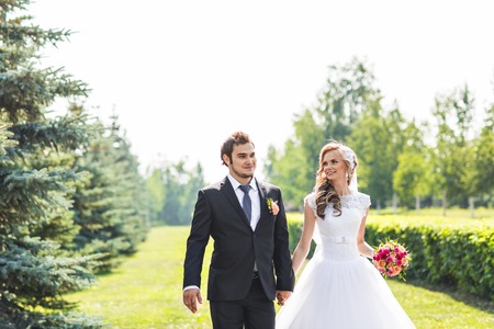 Romantic wedding couple having fun together outdoor in nature.の写真素材