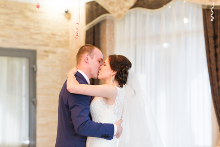 Happy bride and groom on their  wedding indoor.の写真素材