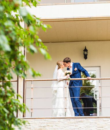 the bride and groom on the balconyの写真素材