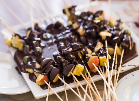 Tasty fruit bouquet with chocolate frosting. Gift for you.の写真素材