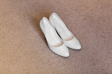 Elegant beautiful white shoes for a brideの写真素材