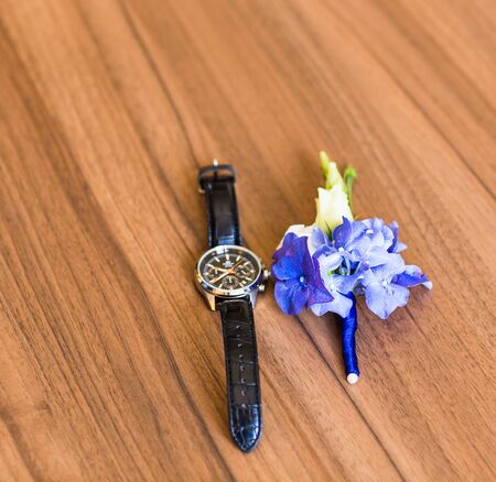Gentle groom's boutonniere and watch. Wedding accessories for a groomの写真素材